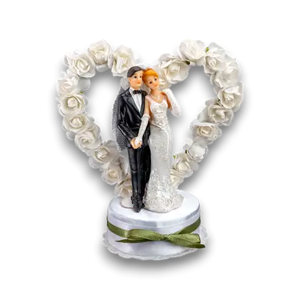 Figurina di matrimonio di coppia su cuore bianco 