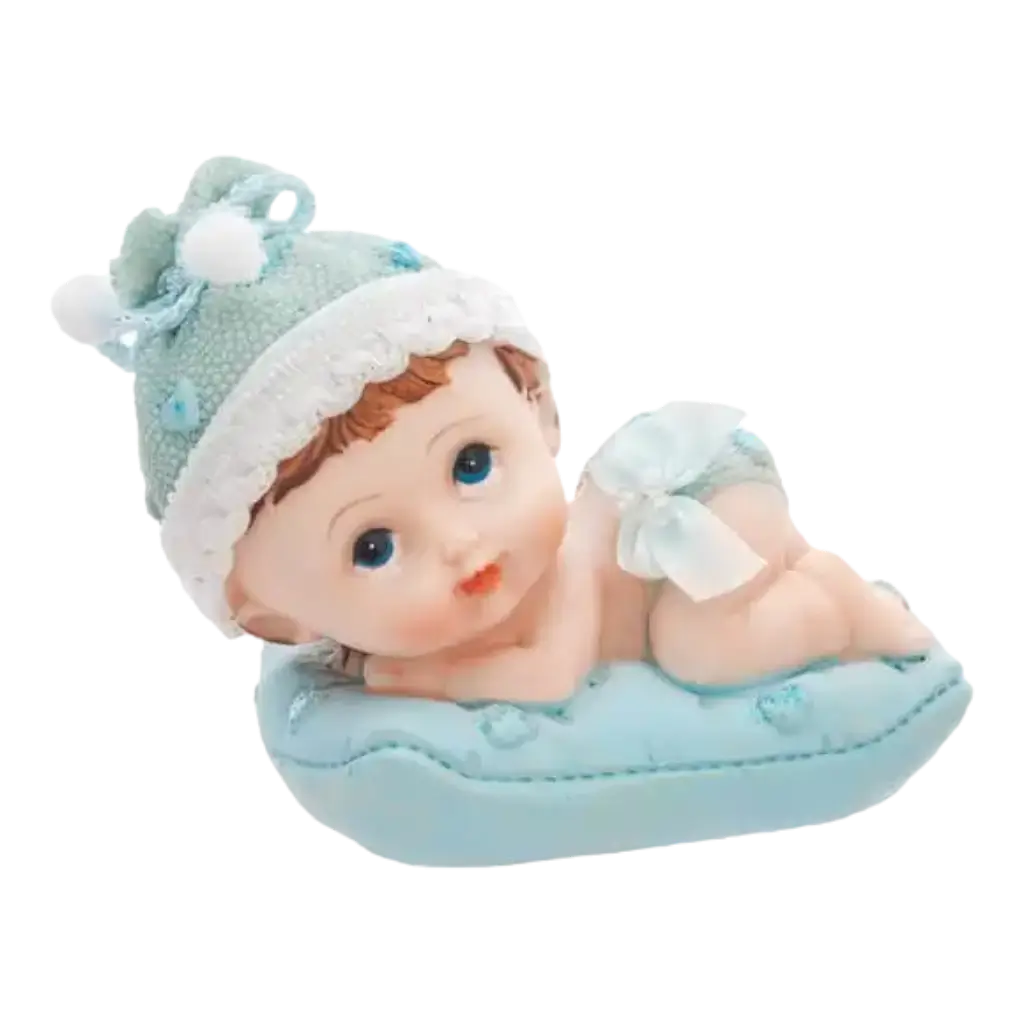 Figurina di bambino su un cuscino blu
