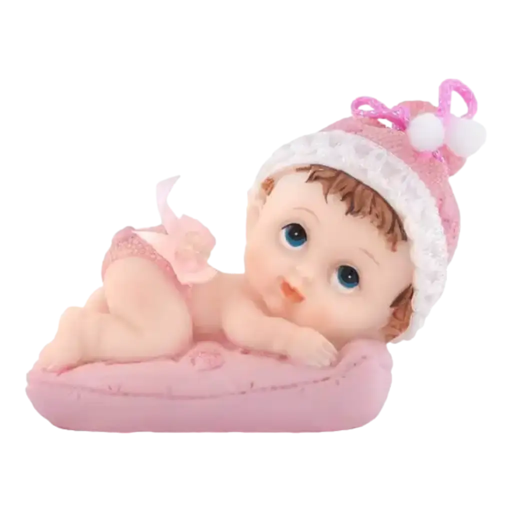 Figurina di bambina su un cuscino rosa